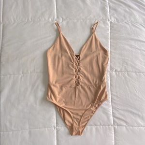 Nude color body suit